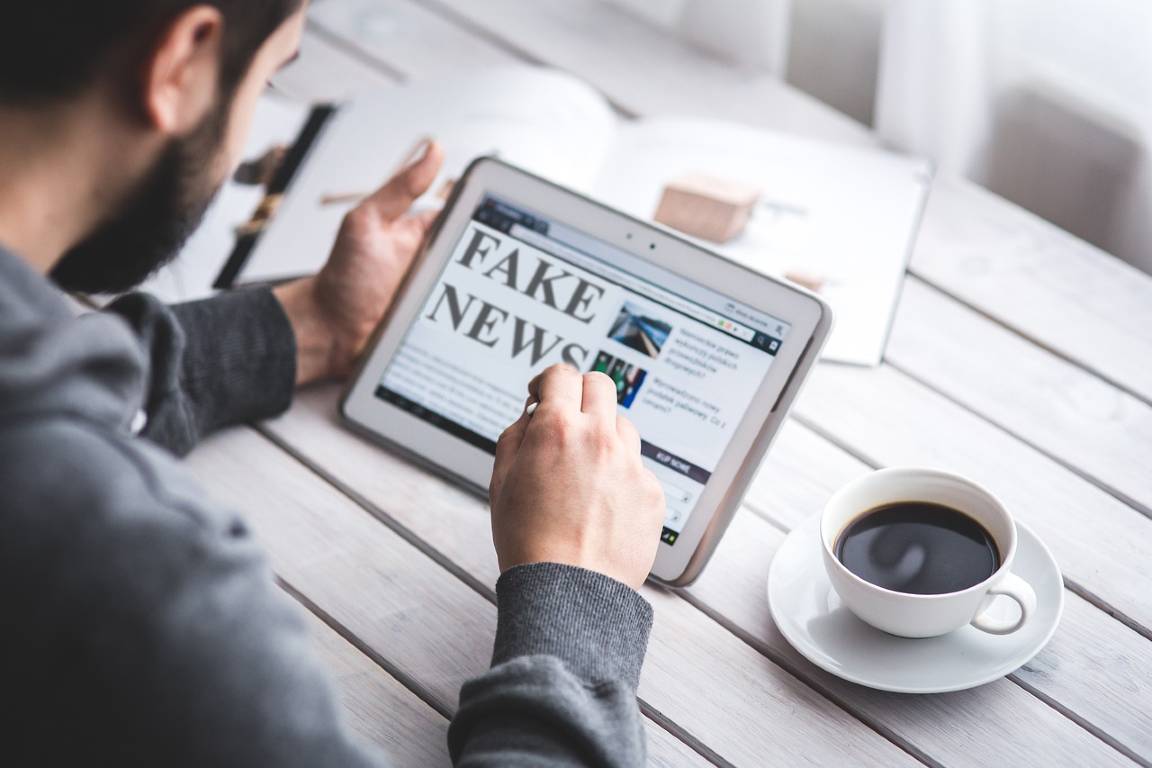 Man reading fake news on social media